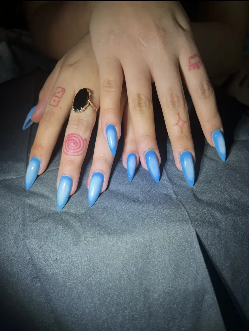 Long glossy sky-blue stiletto nails