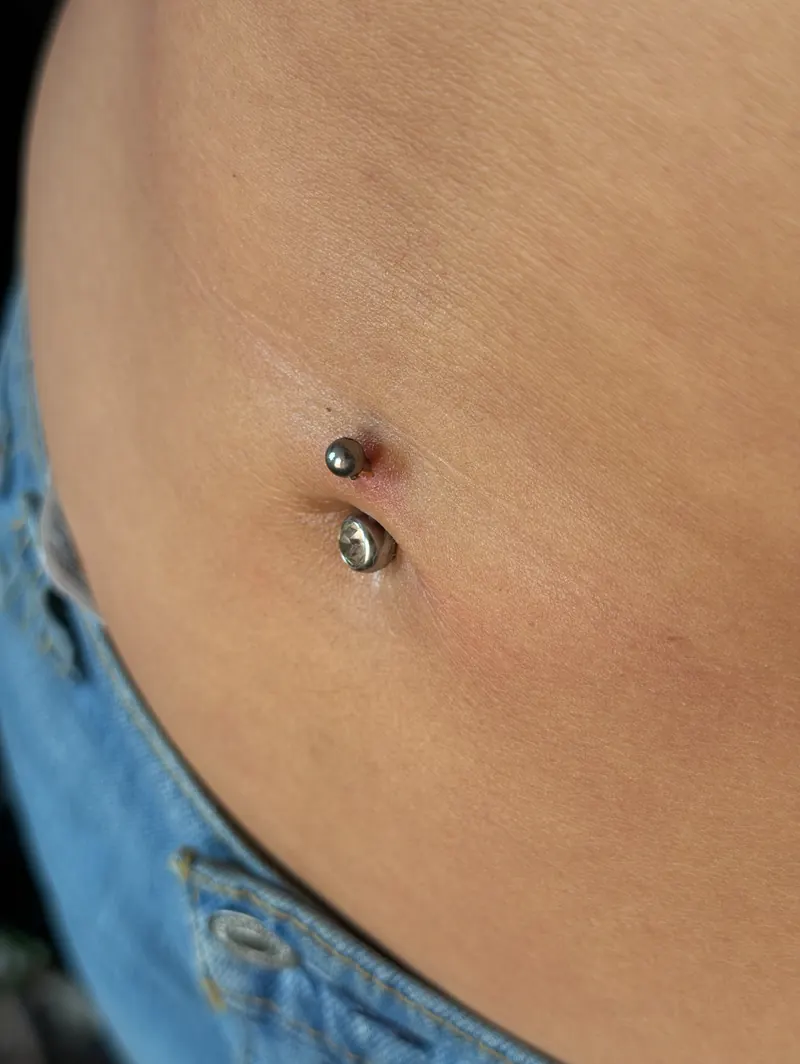 Fresh navel piercing with implant-grade titanium jewelry